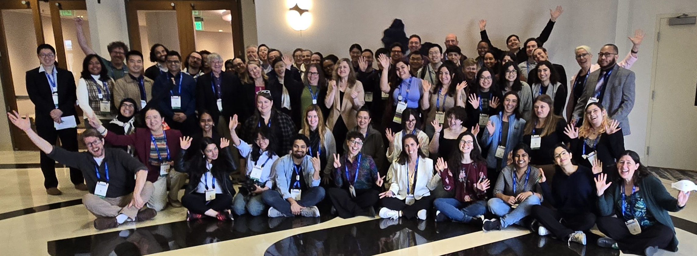 A group photo of about 50 smiling people